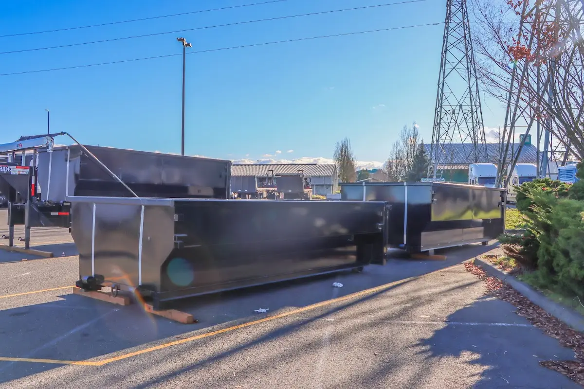 Roll-off dumpster ready for waste disposal at job site for 3 Yard Dumpster Rental in Doffing